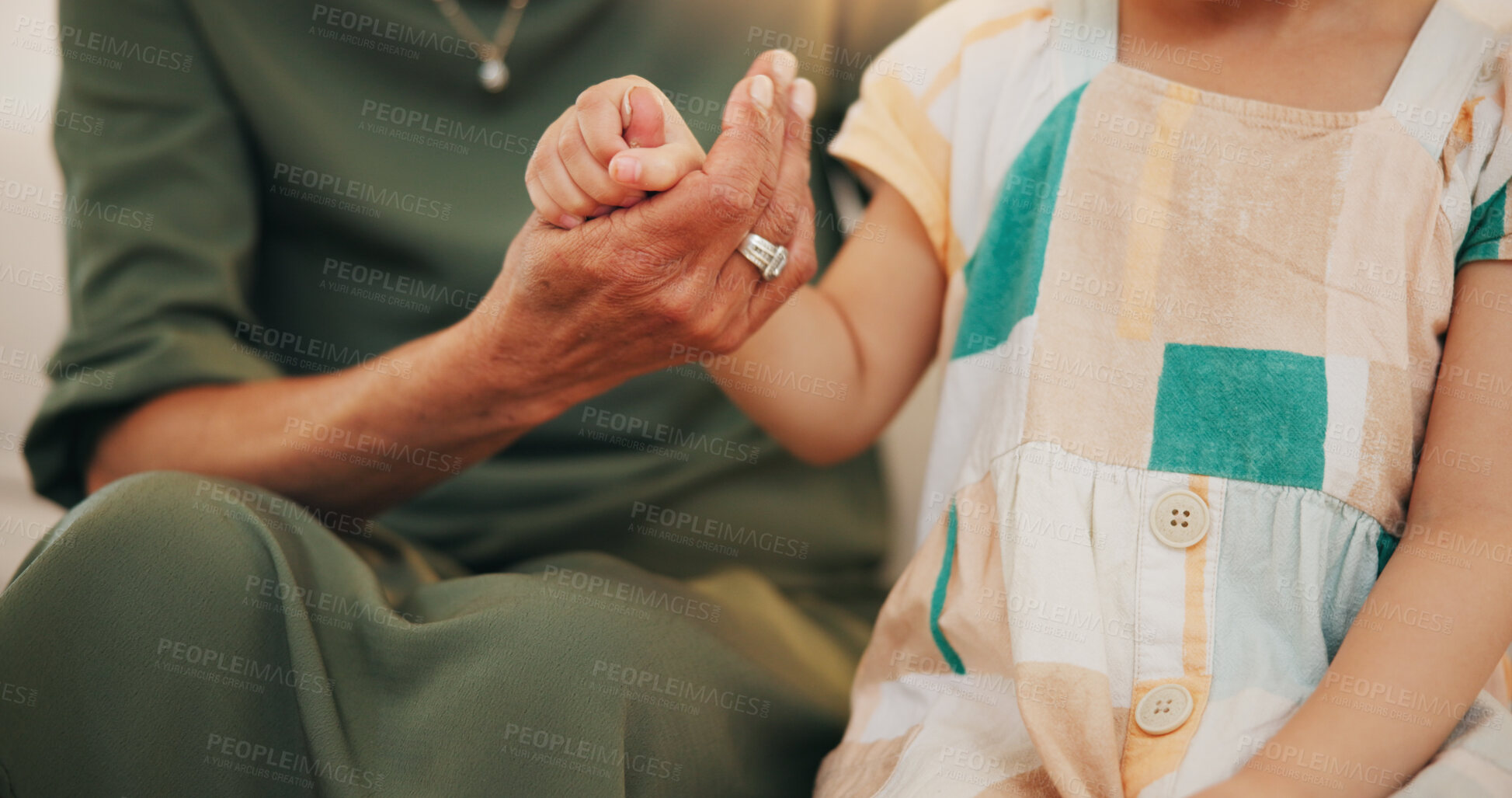 Buy stock photo Child, grandmother and hand closeup as care safety or love together for bonding, protection or relax. Young kid, old woman and fingers or family help connection in retirement, embrace for development