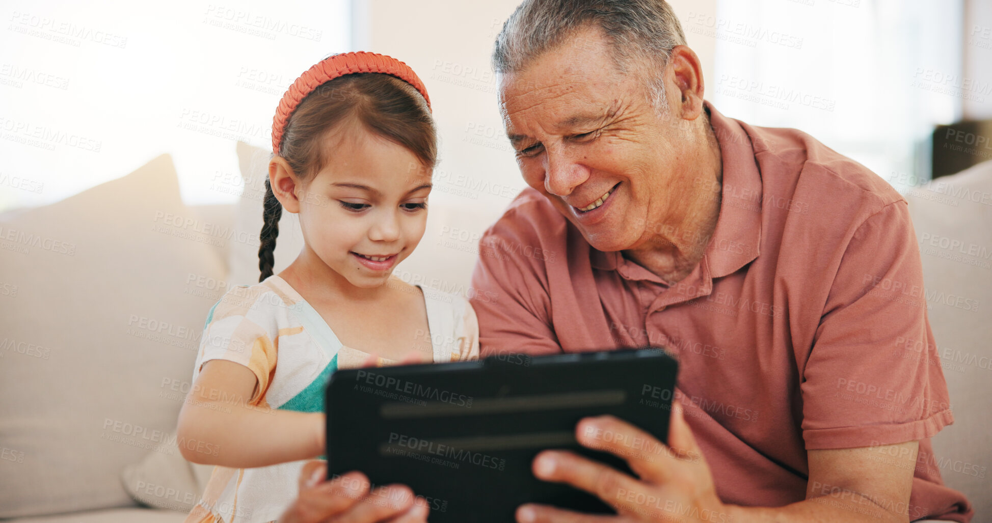 Buy stock photo Home, grandfather and girl with tablet, internet and relax with social media, technology and digital app. Apartment, old man and pensioner with grandchild, happiness and online games with fun