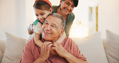 Buy stock photo Grandparents, child and play with smile, home and embrace with love, grandchild and couch. Man, woman and lounge or bonding together for relationship, family and retired with girl, house and kid
