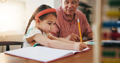 Buy stock photo Grandfather, little girl and writing in book for learning, literature or education together on desk at home. Grandpa, child or kid taking notes in homeschool to read and write on table at house