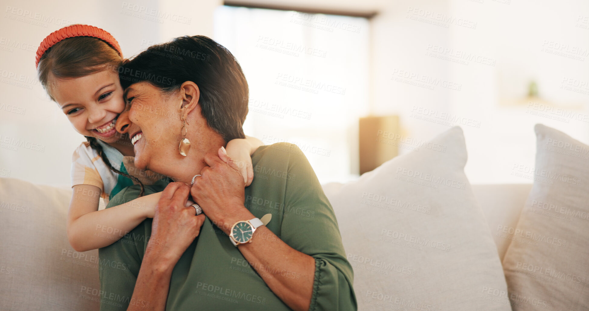 Buy stock photo Child, grandmother and hug on sofa happy for laugh bonding, relax connection in retirement. Girl, old woman and embrace on couch for holiday rest or together in lounge for funny joke, love or care