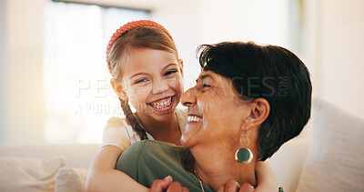 Buy stock photo Child, grandmother and hug on sofa for laugh bonding, relax connection in retirement. Girl, old woman and embrace on couch for holiday rest or together in lounge for funny joke, love support or care