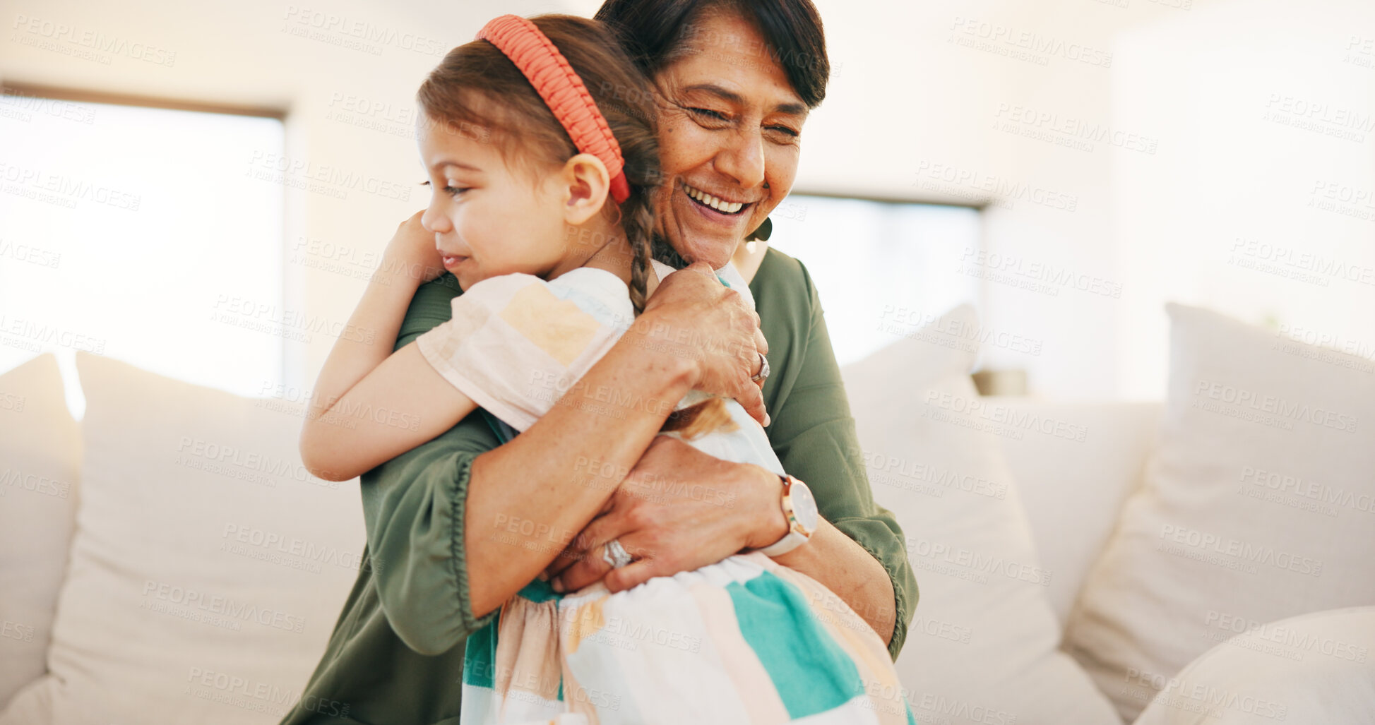 Buy stock photo Grandmother, child and hug on sofa in living room for love, care and bond for relationship. Senior woman, little girl and smile in happiness for memory, moment or support while babysitting at home