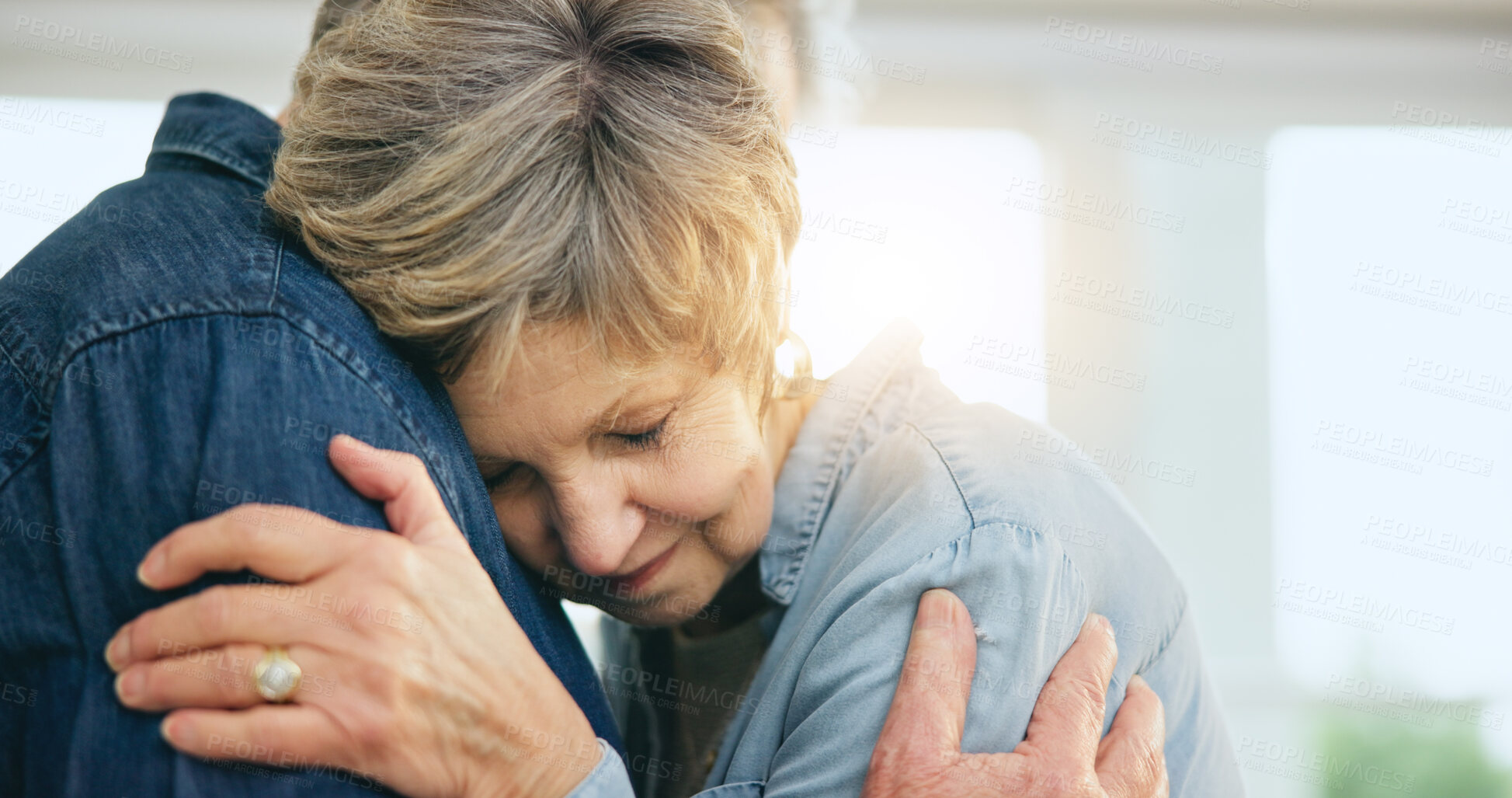 Buy stock photo Senior couple, hug or support in home for love, loyalty or bonding together in retirement in marriage commitment. Mature man, woman or embrace for gratitude, wellness or comfort peace in family house