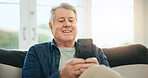 Happy senior man, phone and social media on sofa in relax for communication or networking at home. Mature male person smile on mobile smartphone for online chatting, texting or search at house