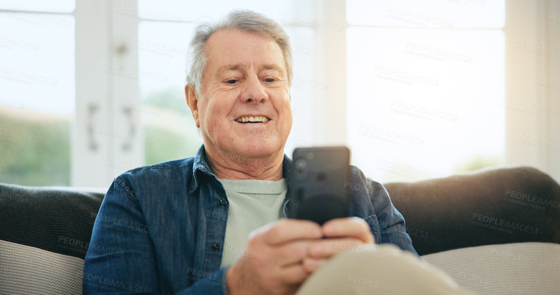 Buy stock photo Happy senior man, phone and social media on sofa in relax for communication or networking at home. Mature male person smile on mobile smartphone for online chatting, texting or search at house