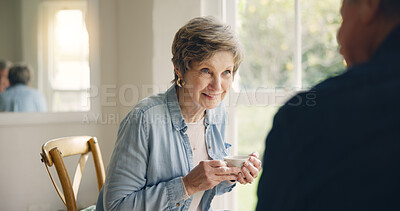 Buy stock photo Happy, coffee or elderly friends in home talking, bonding or enjoying conversation on break together. Smile, support or person in retirement speaking or drinking tea to chat with an senior woman