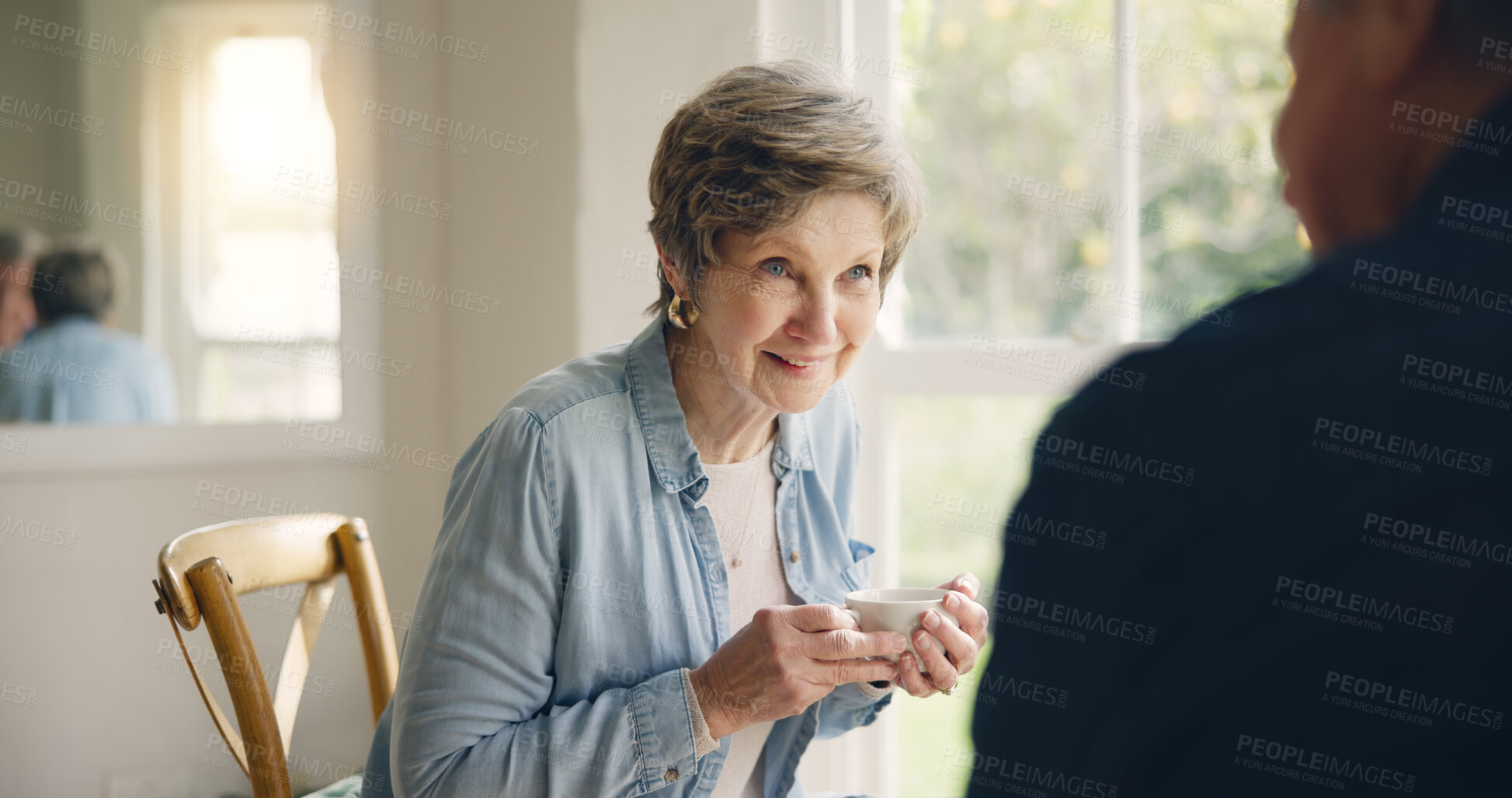 Buy stock photo Happy, coffee or elderly friends in home talking, bonding or enjoying conversation on break together. Smile, support or person in retirement speaking or drinking tea to chat with an senior woman