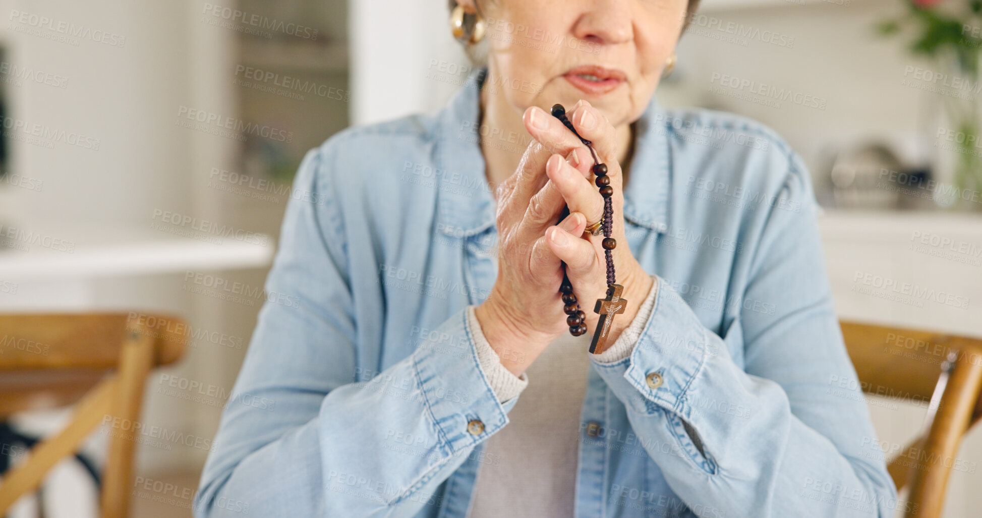 Buy stock photo Closeup, old woman or rosary for prayer, faith or religion with guidance, spiritual or peace in a lounge. Apartment, pensioner or elderly person with beads, Christian or worship with Catholic or home