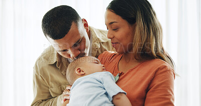 Buy stock photo Family, love and parents kiss baby for bonding, healthy relationship and childcare in home. Happy, childhood and mother, father and newborn infant embrace, care and relax together for happiness