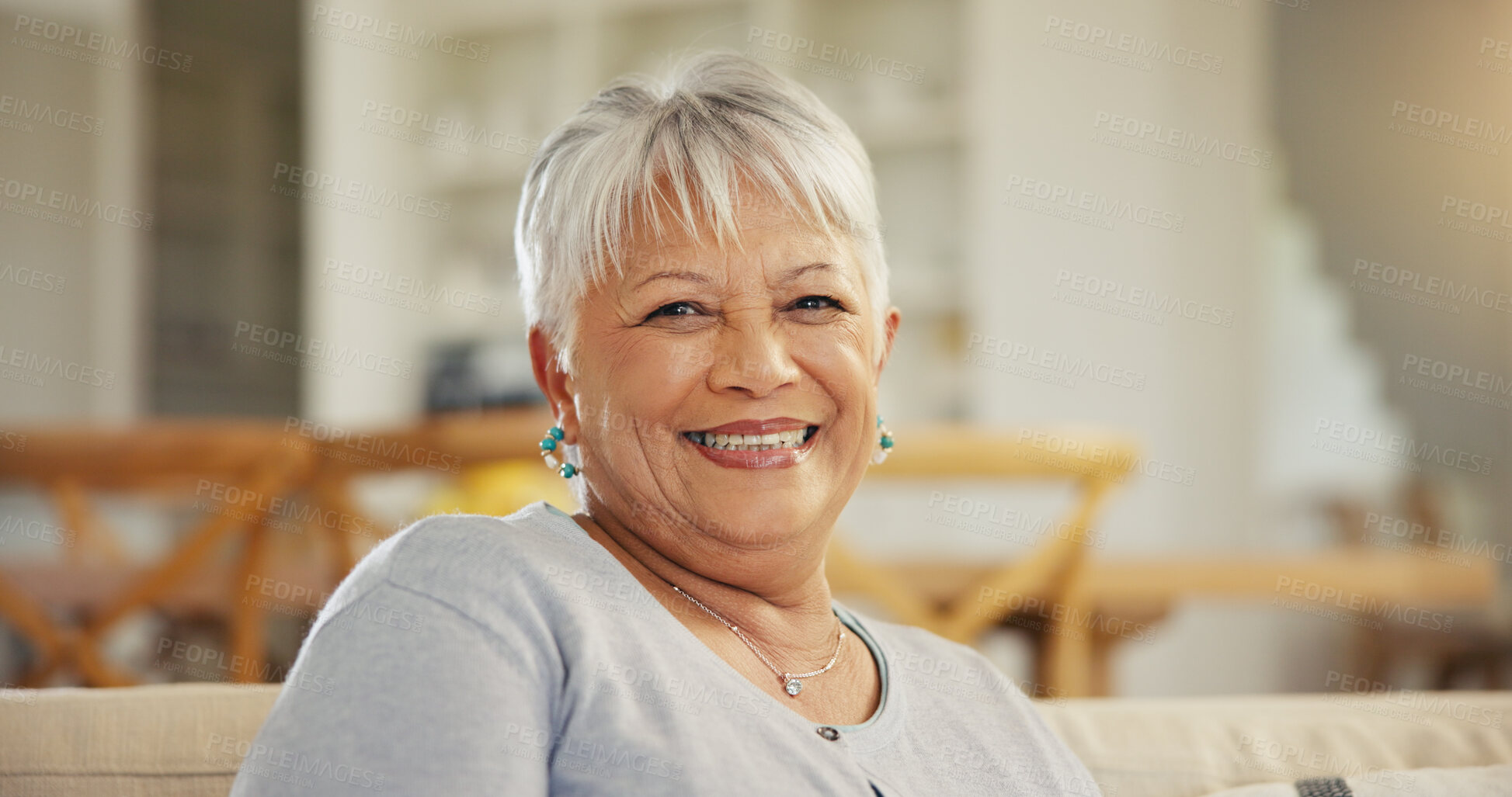 Buy stock photo Senior woman, portrait and smile on sofa in home to relax for retirement, good mood and confidence. Happy face, elderly lady and pensioner in living room with wisdom of old age, grey hair or optimism