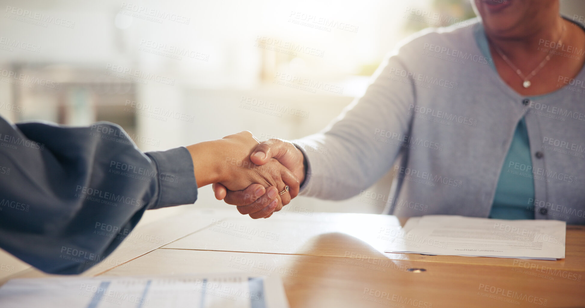 Buy stock photo People, handshake and meeting for retirement plan, documents or paperwork in deal or insurance at home. Closeup of senior woman shaking hands with attorney or lawyer for legal agreement at house