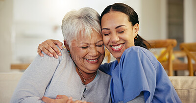 Buy stock photo Happy woman, nurse and hug in elderly care for support, trust or love on living room sofa at old age home. Face of female person, doctor or medical caregiver hugging senior patient in relax at house