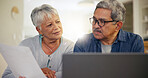Senior couple, laptop and documents in home for budget, planning financial assets or investment portfolio. Man, woman and paperwork at computer of banking loan, retirement savings or insurance policy