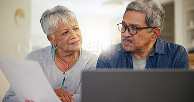 Buy stock photo Senior couple, laptop and documents in home for budget, planning financial assets or investment portfolio. Man, woman and paperwork at computer of banking loan, retirement savings or insurance policy