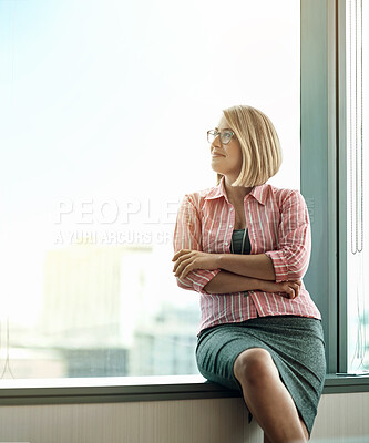 Buy stock photo Cropped shot of a businesswoman looking out the window from an office
