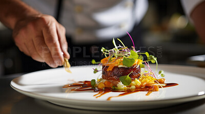 Close-up, chef and food garnishing for fine dining, restaurant cuisine and dinner. Professional worker, creative and cropped closeup image of a hand preparing a delicious healthy meal in a kitchen.