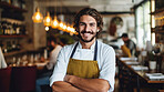 Head Chef, male and portrait of business man standing arms crossed in a restaurant kitchen. Confident, skilled and professional worker looking at camera for owner, career or hospitality occupation