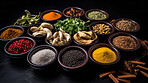 Herbs, spices and Indian seasoning for cooking and traditional cuisine or food. Colourful, fresh and dry spice set for chefs, culture and organic recipe ingredients on a black studio background