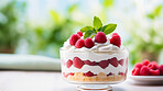 Dessert, layered and traditional trifle treat with whipped cream or raspberry toppings for celebration, party or event. Delicious, sweet and tasty pastry for food photography or valentine anniversary