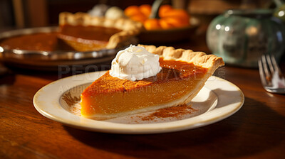 Traditional, pumpkin pie and thanksgiving dessert for festive holiday, celebration or dinner, topped with whipped cream. Delicious, rustic and tasty closeup of a slice of home-made pastry on a plate