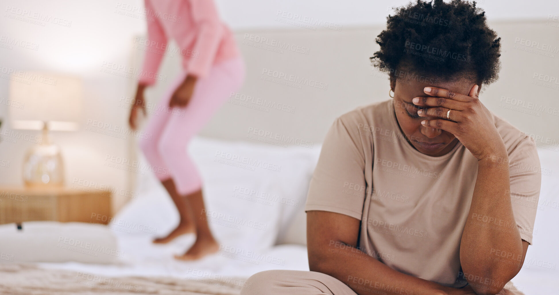 Buy stock photo Frustrated mother, headache and child jumping on bed in stress, anxiety or mental health at home. Tired African mom in depression, mistake or burnout with ADHD kid playing in bedroom chaos at house