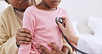 Closeup, child and stethoscope for examination in home for health, wellness or care. Medical professional, doctor and listen to heart, lungs or breathing for illness, virus and respiratory system