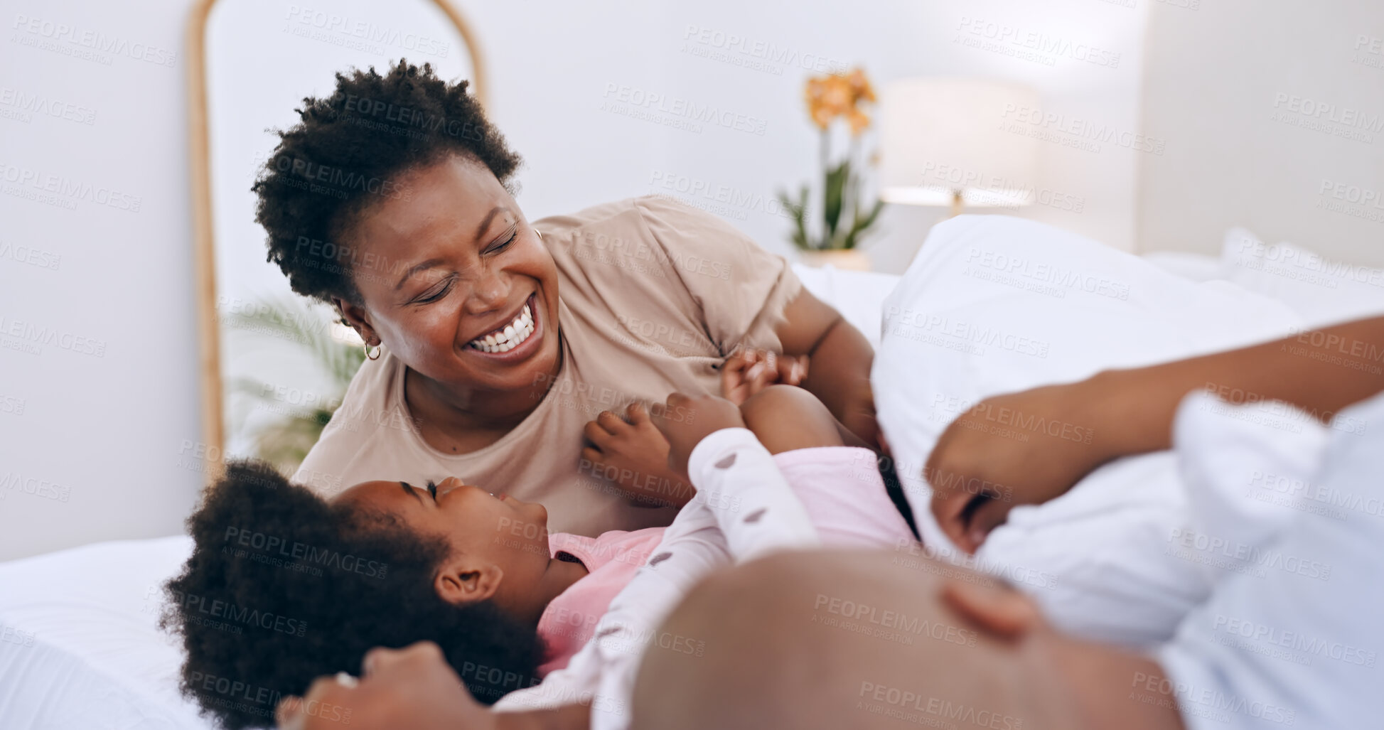 Buy stock photo Bedroom, laugh and black family parents, happy kids or people bonding, love and smile for funny joke. Home wellness, humour and African children, dad and mom support, comedy and conversation on bed