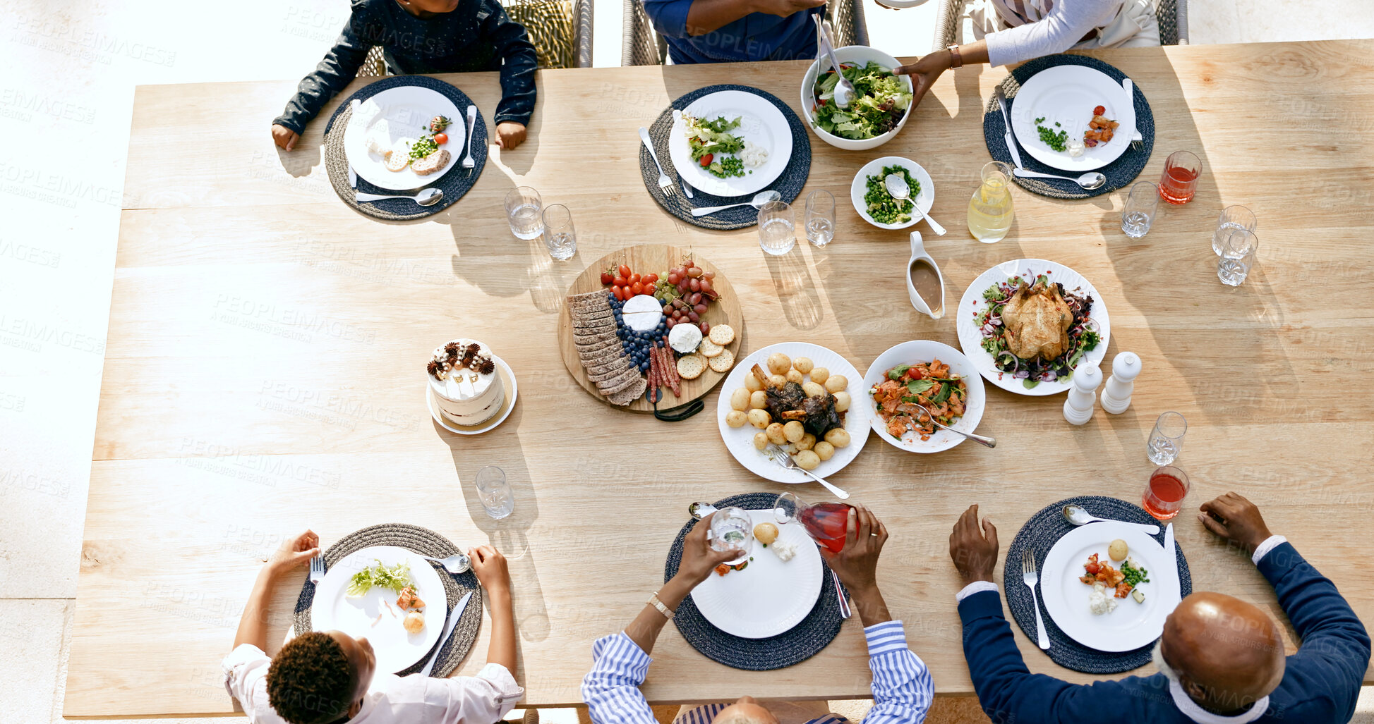 Buy stock photo Table, happy family, and generations with food lunch, summer vacation and reunion together with love. Black people, grandparents, parents and kids at gratitude brunch, hands and above by cuisine