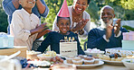 Family, birthday and applause at party with cake, celebration and excited or smile together in home. African parents, kids and clapping at event table outdoor with food, dessert and congratulations