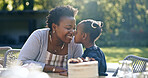 Mother, daughter and nose touch in nature for birthday, garden party and happy celebration in summer. Black people, woman or child with love bonding in smile, cake or smile together in outdoor park