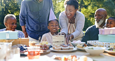 Buy stock photo Young boy, birthday cake or family in garden for party, happy or gift in celebration in nature. Black people, smile and cream dessert with fun with bonding, excited and special kid event in backyard