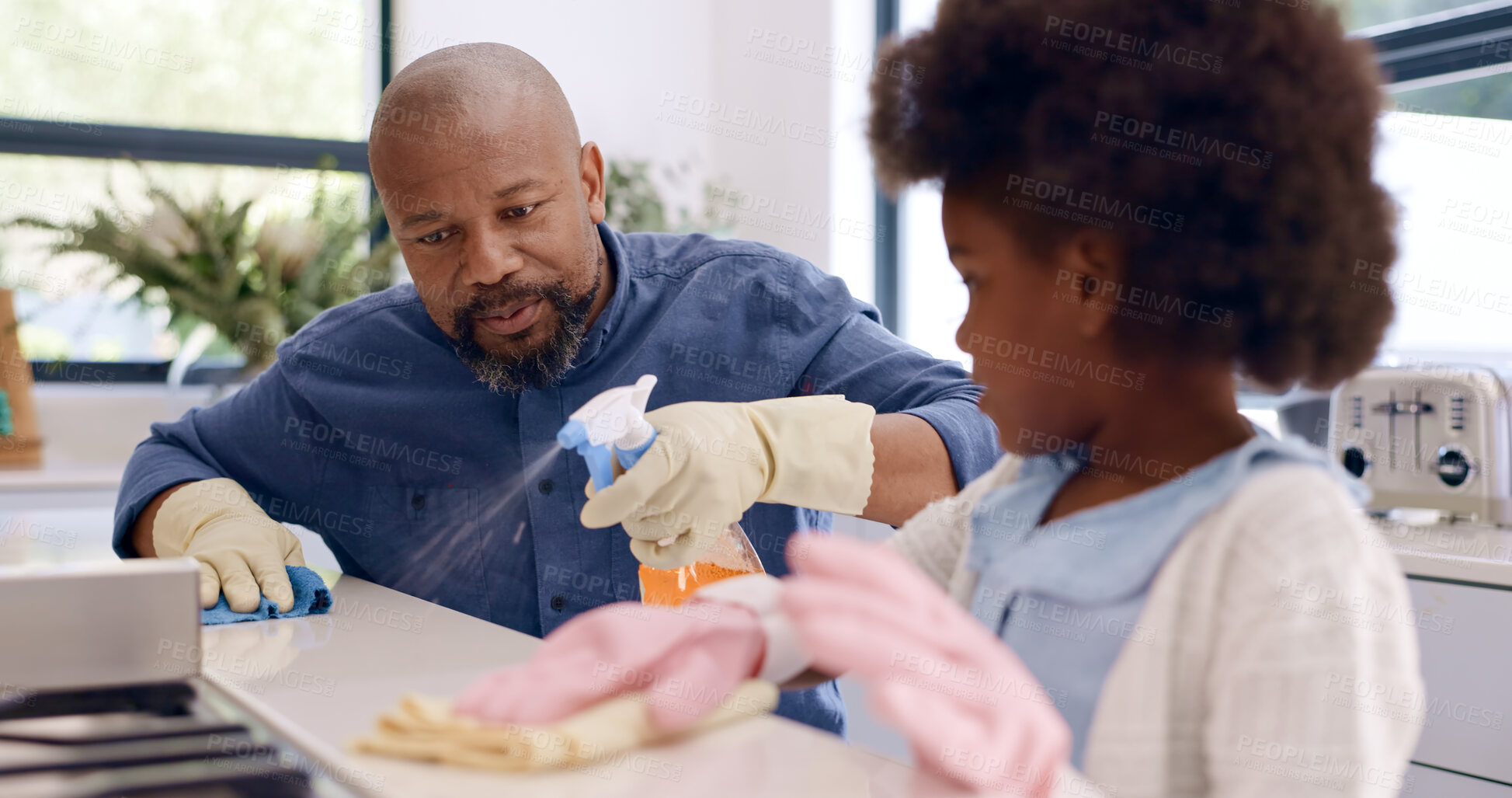 Buy stock photo Kitchen counter, dad teaching or kid cleaning with teamwork, gloves or cloth to wipe off dirty table. Bacteria, child or girl learning to help father on messy surface in a family home with spray