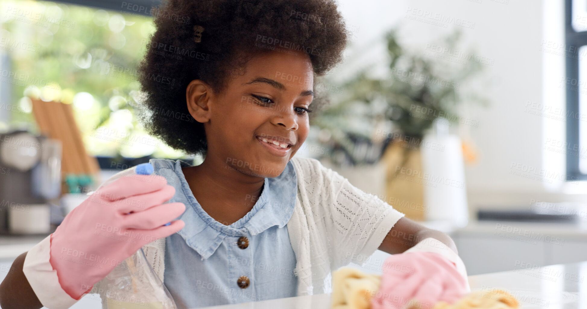 Buy stock photo Child, gloves and happy in kitchen for cleaning, learning housekeeping as youth in home. Black girl, smile and cloth with sanitizer to shine counter and disinfectant surface in house with detergent