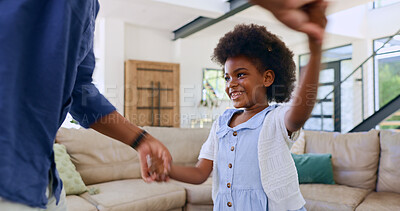 Black family, dance or love with a father and daughter together on holiday in home living room. Smile, music or happy girl child holding hands with parent to relax in the house for fun celebration