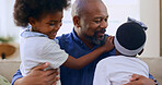 Happy, black family and father with girls, hug and conversation with love, laughing and weekend break. Apartment, dad and children in a lounge, bonding together and joy with vacation, embrace or home
