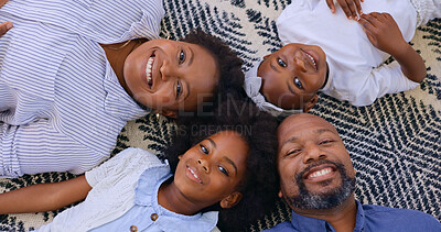 Top view, father or portrait of mother with happy kids in home to relax on holiday vacation with smile. Black family, mom or African dad bonding with girl siblings, love or children on carpet floor