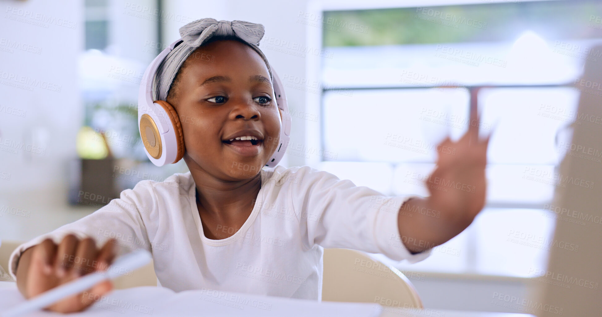 Buy stock photo Black child, headphones and learning in video call, studying and homework in house. African kid in virtual class, distance education and listening to lecture, music and writing notes in home school