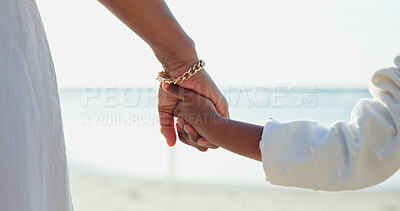 Buy stock photo Woman, child or holding hands for love by beach or bonding together for happiness on summer vacation. Commitment, mother or kid in support relationship, holiday or relax wellness by calm ocean