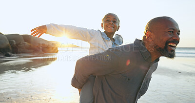 Buy stock photo Father, beach and piggyback with girl, happy and smile for joy, sunset and playful. Parent, child and fun with dad, freedom or joy for childhood, carefree or weekend for laugh, enjoy and love
