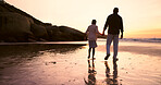 Father, son and holding hands at beach, sunset and support or trust, ocean and solidarity or care. Black family, sea and love or fatherhood, bonding and water on vacation, holiday and peace at dusk