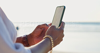 Buy stock photo Closeup, beach and person with a smartphone, typing and connection with vacation, internet and contact. Outdoor, hands and traveller with a cellphone, seaside and holiday with message, app or texting