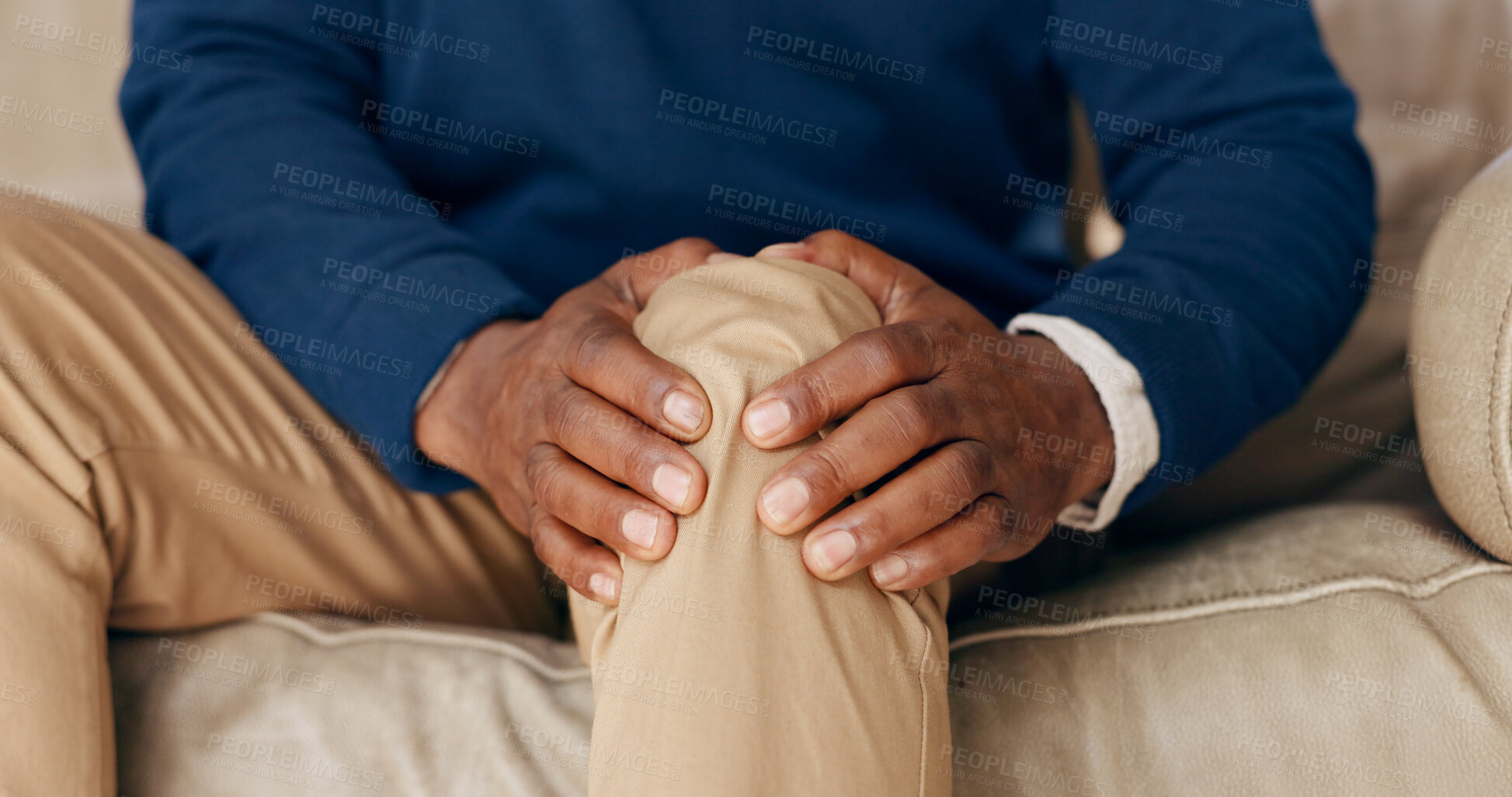 Buy stock photo Knee pain, hands and man in home with arthritis, muscle wound and osteoporosis on sofa. Closeup, healthcare and massage legs for fibromyalgia, orthopedic injury and medical emergency in living room 