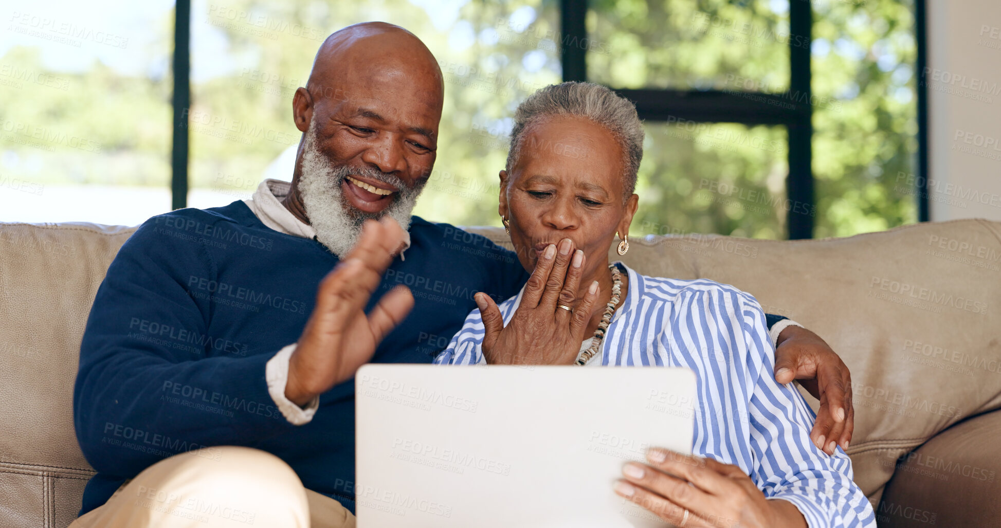 Buy stock photo Senior couple, love and video call on tablet in home together with online communication, chat or live stream. Old people, wave or talk on tech and conversation or air kiss on sofa in living room