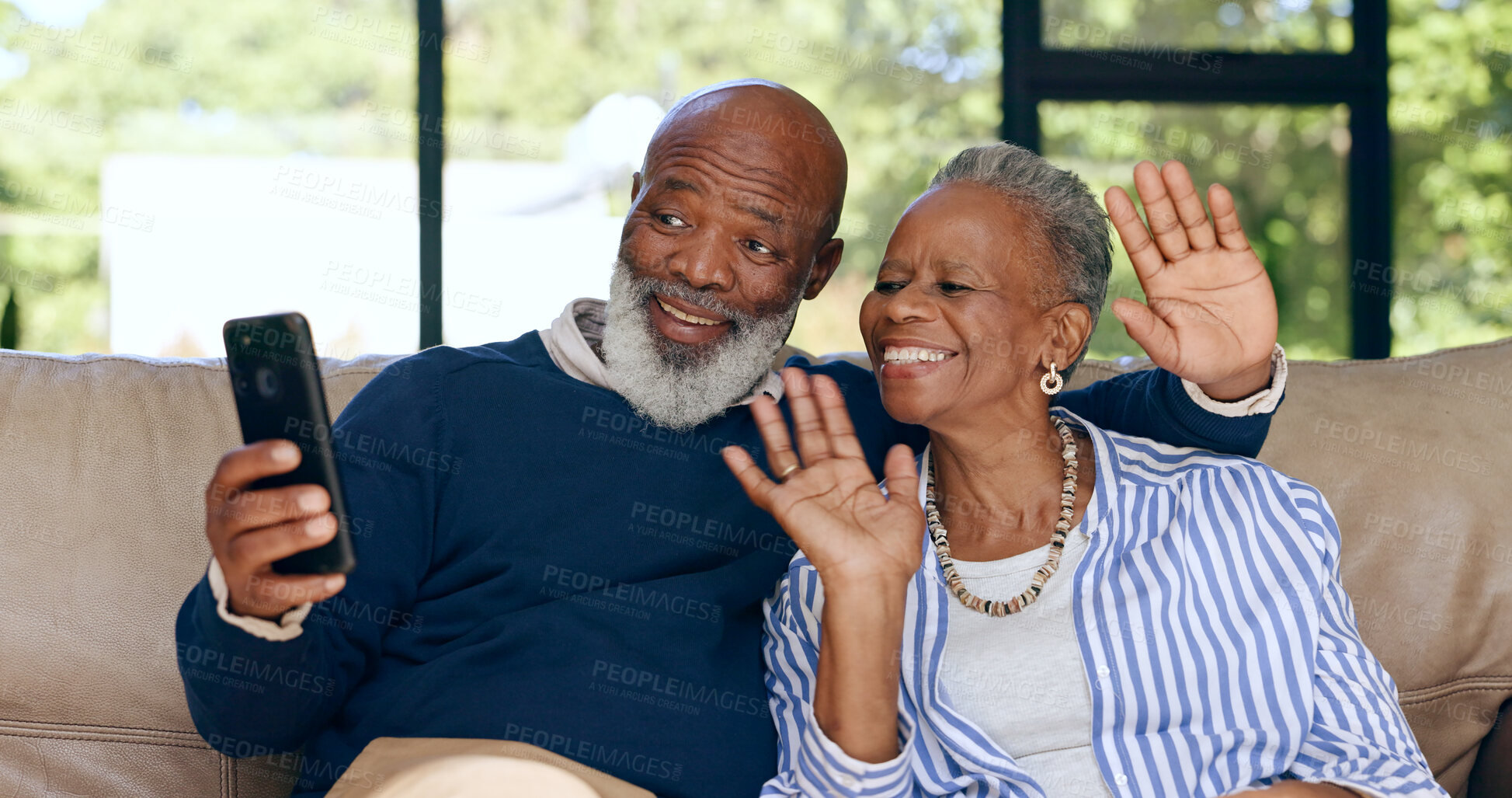 Buy stock photo Happy senior couple, video call and smartphone in home for voip communication, social network or chat. African man, woman and wave hello for virtual conversation, mobile contact or talk in retirement