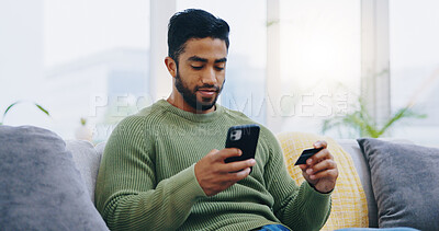 Buy stock photo Man, credit card and phone on living room sofa with online shopping, ecommerce and decision with sale. Person, smartphone and easy payment with click, banking and fintech on lounge couch in home