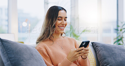 Buy stock photo Woman, living room sofa and texting with phone, smile and click for contact, meme and notification in home. Girl, smartphone and happy with click, reading and app for social media, video and relax