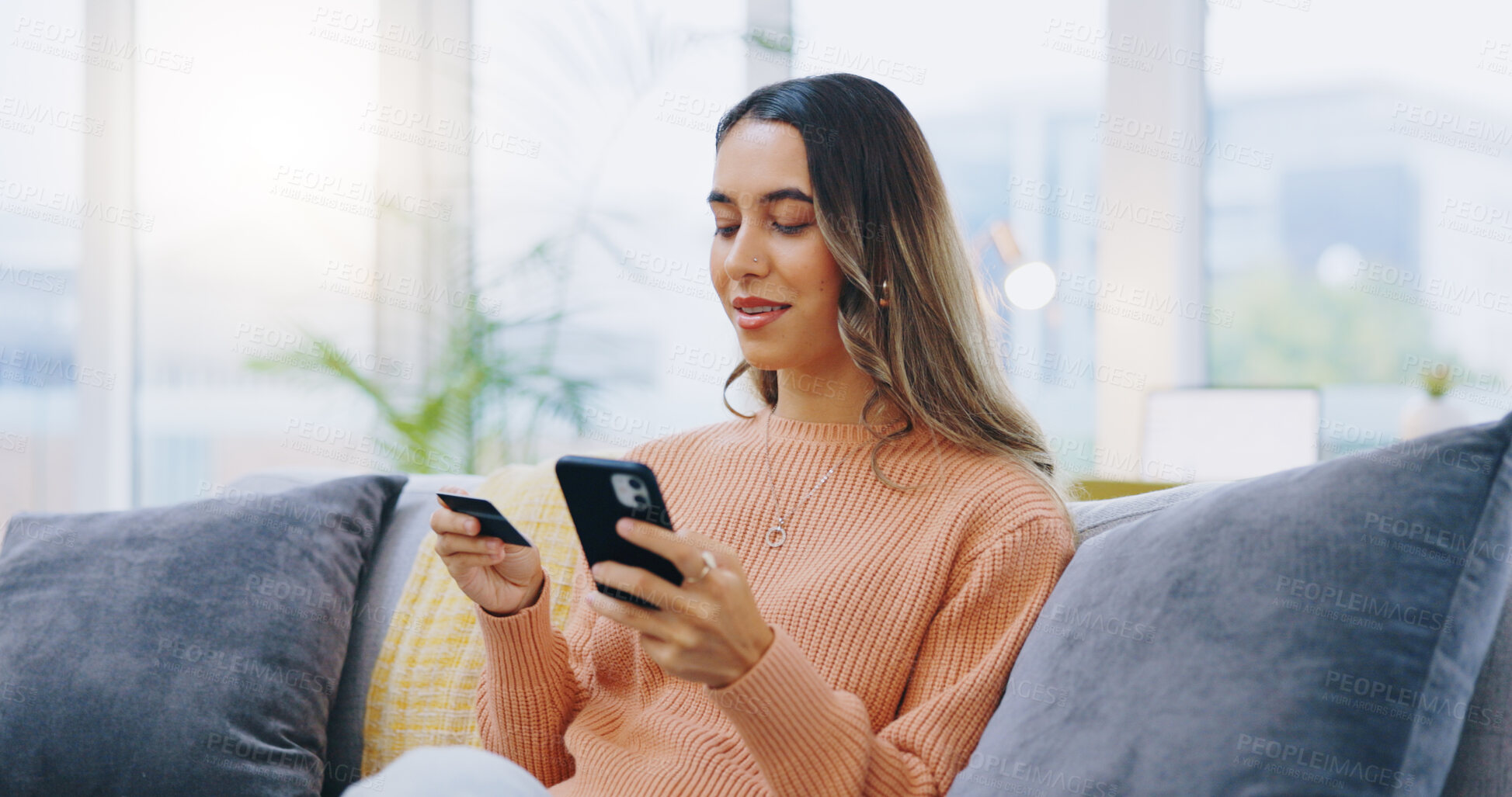 Buy stock photo Credit card, phone and woman on a sofa with ecommerce, sale or bank, loan and payment in her home. Smartphone, app and female person in a living room for online shopping, code or password for sign up