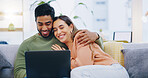Couple, love and smile with laptop on sofa to watch movies, comedy subscription and online shopping at home. Happy man hug interracial woman at computer to download funny multimedia show in lounge