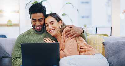 Buy stock photo Couple, love and smile with laptop on sofa to watch movies, comedy subscription and online shopping at home. Happy man hug interracial woman at computer to download funny multimedia show in lounge